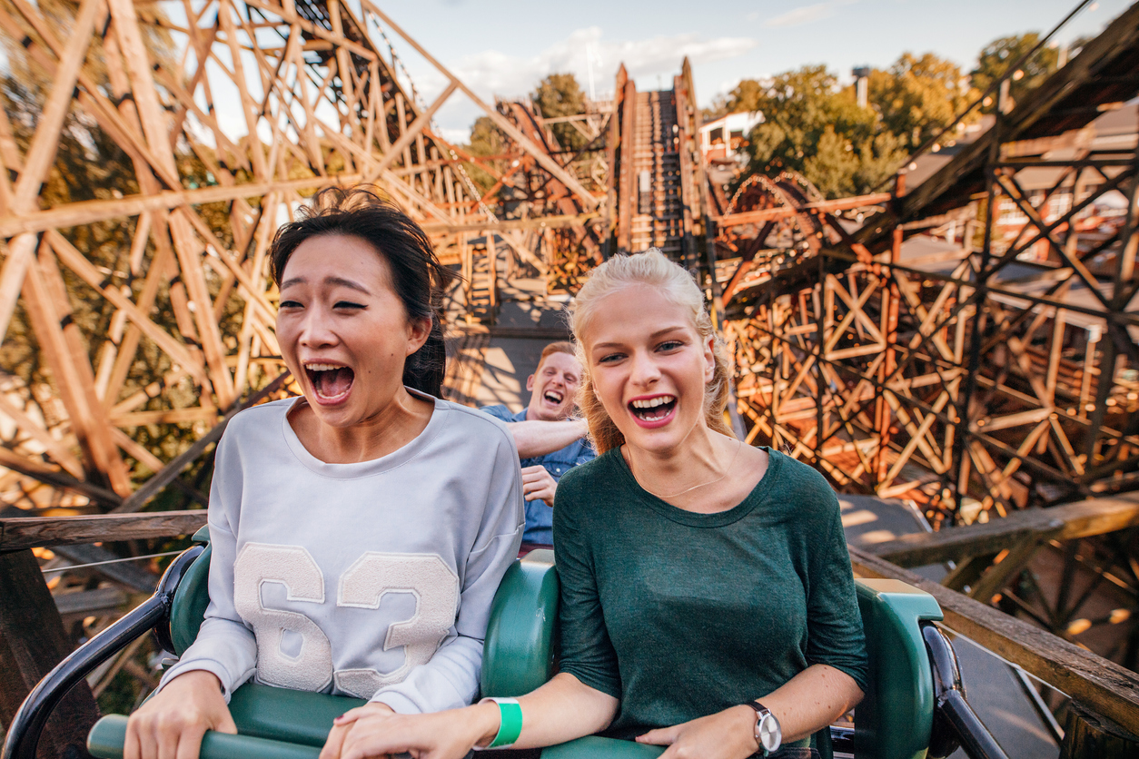 friends riding a rollercoaster | Amusement Parks around Lone Tree