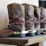 selection of cowboy boots on a shelf | western wear stores near lone tree