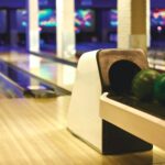 a variety of colorful bowling balls in front of a lane at a bowling alley | bowling alley Lone Tre
